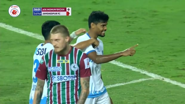 Ritwik Das curls the ball into the bottom left corner